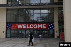 A person walks outside the Charlotte Convention Center, the site of the Republican National Convention, in Charlotte, North Carolina, U.S., August 22, 2020. REUTERS/Leah Millis