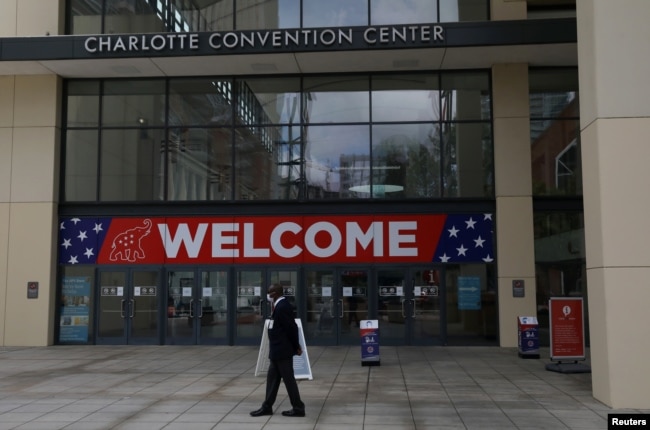 A person walks outside the Charlotte Convention Center, the site of the Republican National Convention, in Charlotte, North Carolina, U.S., August 22, 2020. REUTERS/Leah Millis