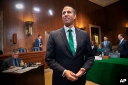 FCC Chairman Ajit Pai prepares to testify about his budget before a Senate Appropriations subcommittee on Capitol Hill in Washington, May 17, 2018.