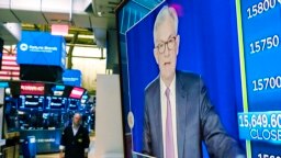 Federal Reserve Chairman Jerome Powell appears on a television screen on the floor of the New York Stock Exchange, Nov. 3, 2021. 