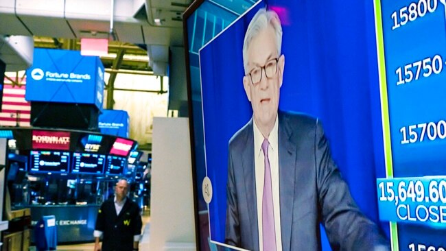 Federal Reserve Chairman Jerome Powell appears on a television screen on the floor of the New York Stock Exchange, Nov. 3, 2021.