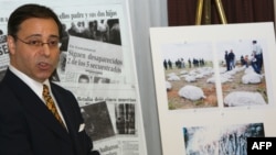 FILE - U.S. lawyer Jonathan Reiter addresses a press conference next to newspaper clippings and photos displaying stories of alleged torture and killing by Colombian paramilitaries on the payroll of banana giant Chiquita Brands International in New York, Nov. 14, 2007.