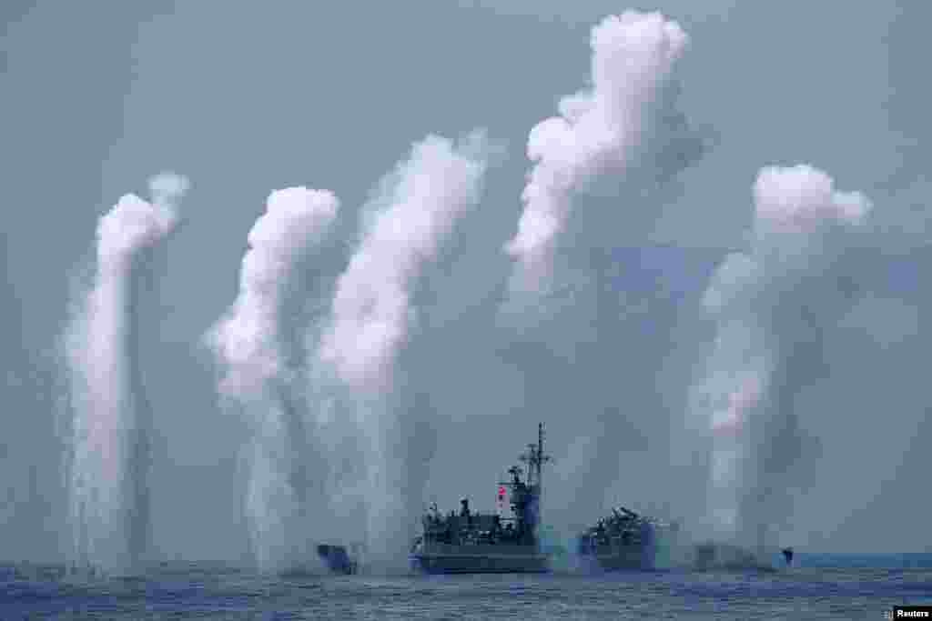 Flares are set off from a Fong Yang Chi Yang class frigate during a drill near Yilan naval base, Taiwan.