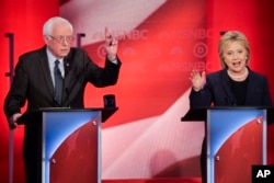 Sen. Bernie Sanders of Vermont reacts to former Secretary of State Hillary Clinton's answer to a question during a Democratic presidential primary debate hosted by MSNBC at the University of New Hampshire in Durham, Feb. 4, 2016.