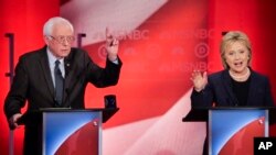 Sen. Bernie Sanders of Vermont reacts to former Secretary of State Hillary Clinton's answer to a question during a Democratic presidential primary debate hosted by MSNBC at the University of New Hampshire in Durham, Feb. 4, 2016.