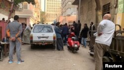 Family members of those convicted and executed for the killing of public prosecutor Hisham Barakat gather at Zynhom morgue in Cairo, Egypt, Feb. 20, 2019, as they wait for their bodies to be released.