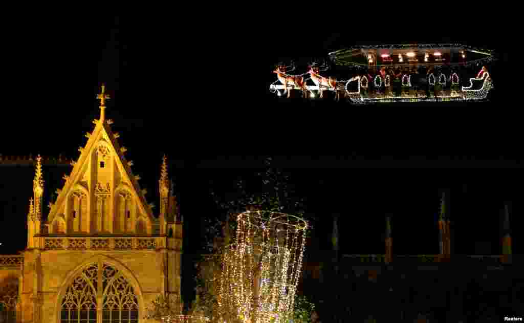 Guests enjoy dinner at the table &quot;Santa in the sky&quot;, lifted by a crane and decorated to match the appearance of a &quot;Santa Sleigh&quot; as part as the Christmas festivities, in Brussels, Belgium.