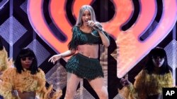 FILE - Hip-hop recording artist Cardi B performs at Z100's iHeartRadio Jingle Ball in New York on Dec. 7, 2018.
