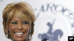 Musician Whitney Houston arrives at the 17th Carousel of Hope Ball benefiting the Barbara Davis Center for Childhood Diabetes in Beverly Hills, California Oct. 28, 2006.