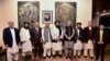 Pakistan's Foreign Minister Shah Mahmood Qureshi, fourth right, and other top officials pose for photograph with Taliban Foreign Minister Amir Khan Muttaqi and his delegation prior to their meeting, in Islamabad, Nov. 11, 2021. (Pakistan Ministry of Foreign Affairs via AP)