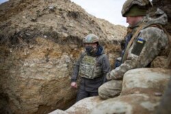 Ukrainian President Volodymyr Zelenskyy looks on as he visits the war-hit Donbas region, eastern Ukraine, Thursday, April 8, 2021.