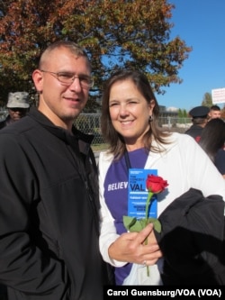 Cathy King holds a rose presented by her son, sailor Devin King, who’s stationed at the Washington Navy Yard. An anonymous woman distributed roses to honor active-duty personnel at the Concert for Valor in Washington, D.C., Nov. 11, 2014.
