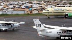 A general view shows United Nations planes in the forefront, with a camp for displaced people in the background at Mpoko airport in Bangui, Central African Republic, May 1, 2014.