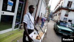 Yurien Roja, 40, sells guava pie bars on the streets in Havana, Cuba, September 5, 2018. Picture taken on September 5, 2018. 