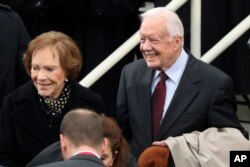 Former President Jimmy Carter and former first lady Rosalynn Carter arrive during the 58th Presidential Inauguration at the U.S. Capitol in Washington, Jan. 20, 2017.