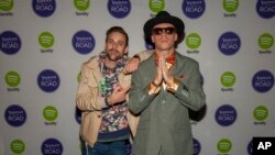 Ryan Lewis and Macklemore pose for photos at the Yahoo! On the Road Concert Series at Turner Hall, May, 12, 2013 in Milwaukee.