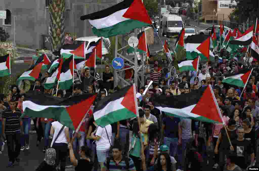 On October 1, 2012, Israeli-Arab protesters chant slogans during a demonstration marking the 12th anniversary of clashes between protesters and Israeli security forces which left 13 protesters dead 12 years ago. 