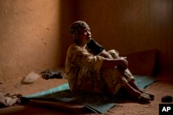 Janet Kamara, from Liberia, sits during an interview conducted in an International Organization for Migration transit center in Arlit, Niger on June 2, 2018.