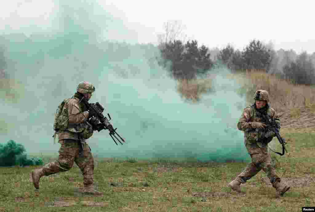 Members of U.S. 2-8 CAV, 1st Brigade Combat Team, 1st Cavalry Division take part in a joint attack combat military exercise with Poland's 1st Mechanized Battalion of the 7th Coastal Defence Brigade near Drawsko-Pomorskie.