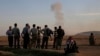 Kurds Bury Kobani Dead in Makeshift Graves Over Border