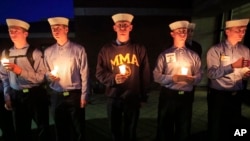 Maine Maritime Academy students attend a vigil of hope for the missing crew members of the U.S. container ship El Faro, Tuesday evening, Oct. 6, 2015.