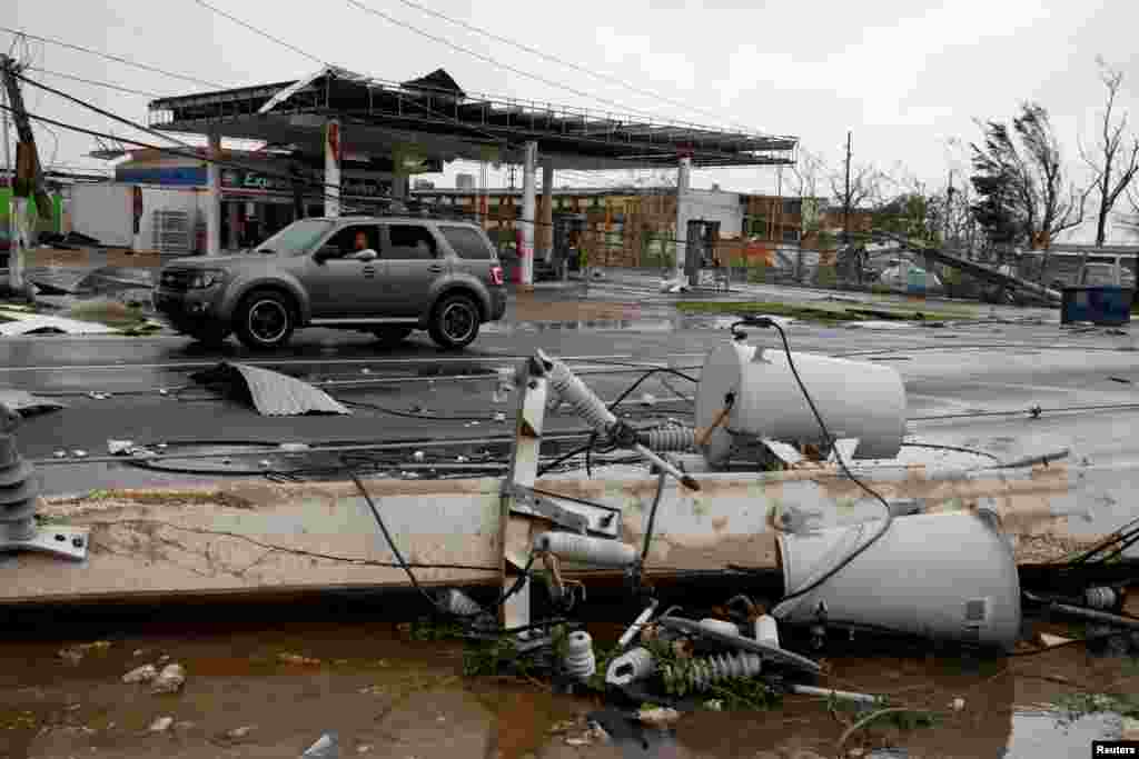 Damaged electrical installations are seen after the area was hit by Hurricane Maria in Guayama, Puerto Rico, Sept. 20, 2017. 