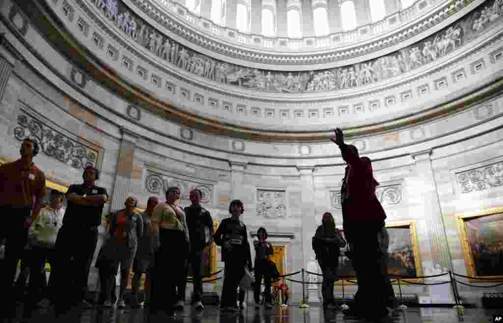 Visitors are led on an official tour, which had been suspended during the 16-day government shutdown, at the U.S. Capitol in Washington, D.C., Oct. 17, 2013. 