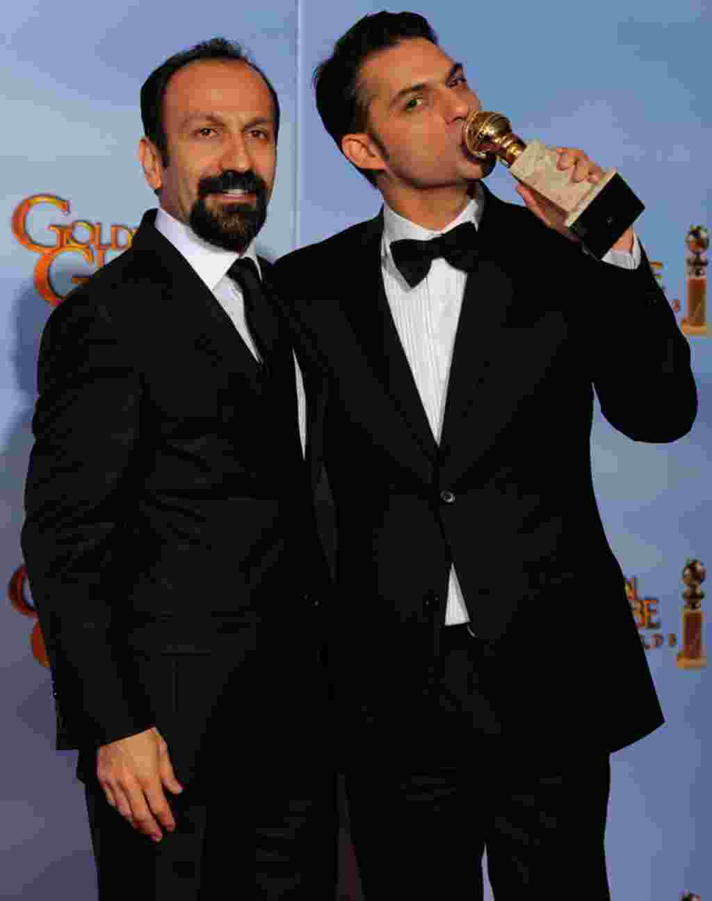 Director Asghar Farhad, left, and actor Peyman Moadi pose backstage with the award for Best Foreign Language Film for "A Separation" during the 69th Annual Golden Globe Awards on January 15, 2012, in Los Angeles. (AP)