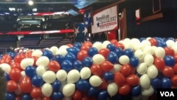 Red, white and blue balloons bundled up before being lifted to the ceiling of the Tampa Bay Times Forum for the traditional "balloon drop" on the final convention night.