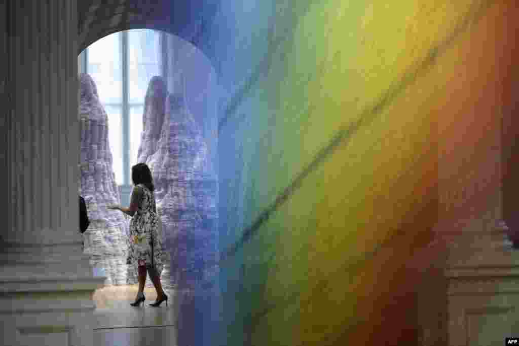 U.S. First Lady Michelle Obama is seen through Gabriel Dawe's Plexus A1 at the Smithsonian's Renwick Gallery in Washington, DC.