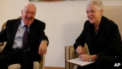 Ken Hackett, left, U.S. Ambassador to the Holy See, and Gina McCarthy, U.S. Environmental Protection Agency chief, lead a news briefing at the ambassador's residence in Rome, Jan. 30, 2015.