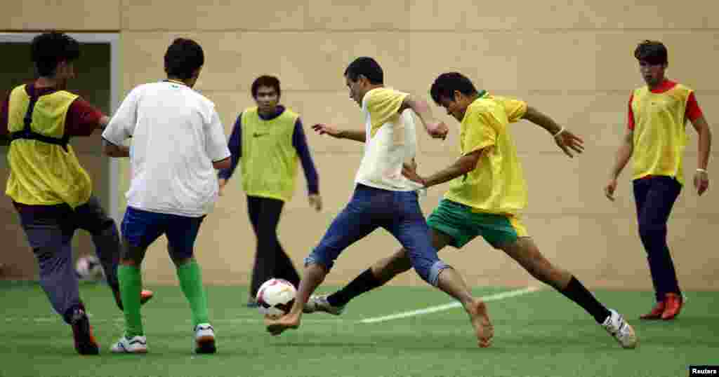 Asylum seekers take part in a soccer training session in Vienna, Austria. Austrian top league soccer club FK Austria Wien provides facilities and professional coaches to migrants for recreation and talent seeking.