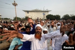FILE - A supporter of the Tehreek e-Labbaik Pakistan (TLP) Islamist political party chants slogans with others during a protest after the Supreme Court overturned the conviction of a Christian woman sentenced to death for blasphemy against Islam, in Lahore, Pakistan, Nov. 2, 2018.