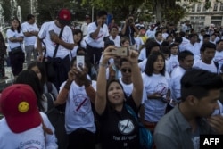 Demonstrators rally in Yangon on Jan. 22, 2017 to denounce the country's controversial sweeping telecommunications law.