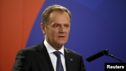 European Council President Donald Tusk addresses a joint press conference at the end of the Valletta Summit on Migration in Valletta, Malta, Nov. 12, 2015.