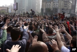 FILE - Anti-military protesters, mostly supporters of ousted President Mohamed Morsi, gathered on the third anniversary of the Egypt's 2011 uprising in Egypt, Jan. 25, 2014.