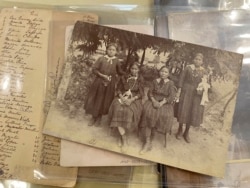 This July 8, 2021 image of material archived at the Center for Southwest Research at the University of New Mexico in Albuquerque, New Mexico, shows a group of unidentified Indigenous students who attended the Ramona Industrial School in Santa Fe. (AP Pho
