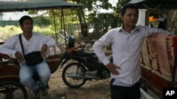 Cambodian tuk tuk drivers in Siem Reap, like Chan and Sambath, are not being helped by the rise in Asian tourists. 