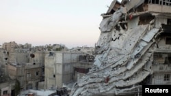 Buildings damaged by what activists said was shelling by forces loyal to Syrian President Bashar al-Assad, Al-Khalidiya neighbourhood, Homs June 28, 2013.