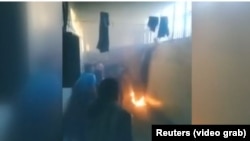 An image from a video taken inside the Hama Central Prison during rioting.