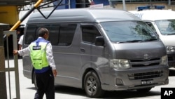 FILE - An unidentified van believed to be carrying the body of Kim Jong Nam comes out from the forensic department at Kuala Lumpur Hospital in Kuala Lumpur, Malaysia, March 30, 2017.