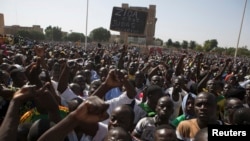 Pro-democracy protesters chant slogans against military rule at Place de la Nation in Ouagadougou, capital of Burkina Faso, Nov. 2, 2014.