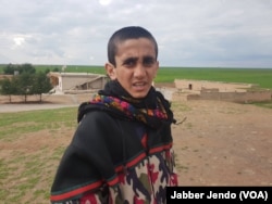 Mazin Salim, a Yazidi boy who was freed from Islamic State on Feb. 22, 2019, is photographed near Hasaka, Syria, Feb. 27, 2019. (J. Jendo/VOA)