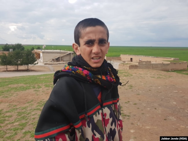 Mazin Salim, a Yazidi boy who was freed from Islamic State on Feb. 22, 2019, is photographed near Hasaka, Syria, Feb. 27, 2019. (J. Jendo/VOA)