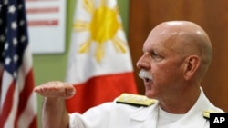 U.S. Pacific Fleet Commander Adm. Scott Swift gestures during an interview with journalists July 17, 2015 in Manila, Philippines. 