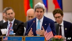 U.S. Secretary of State John Kerry, center, speaks during the 7th Lower Mekong Initiative (LMI) ministerial meeting in Naypyitaw, Myanmar, Saturday, Aug. 9, 2014. Already scrambling to confront multiple simultaneous international crises, the Obama adminis