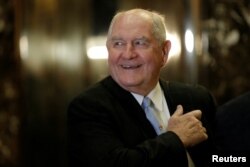 FILE - Former Georgia Governor Sonny Perdue arrives for a meeting with U.S. President-elect Donald Trump at Trump Tower in New York, Nov. 30, 2016.