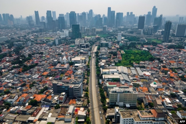 FILE - This aerial photo shows a road leading to Jakarta city center.