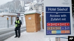 A police officer guards a checkpoint at the Seehof hotel during the World Economic Forum in Davos, Switzerland, Jan. 20, 2016. 
