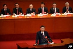 ປະທານປະເທດຈີນ Xi Jinping ຂຶ້ນກ່າວເປີດກອງປະຊຸທສະພາ ຄັ້ງທີ 19 ທີ່ສະພາປະຊາຊົນ ໃນປັກກິ່ງ, 18 ຕຸລາ 2017.